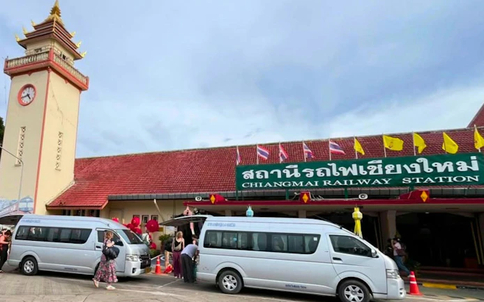 Private transfer vans at Chiang Mai Railway Station, Thailand.