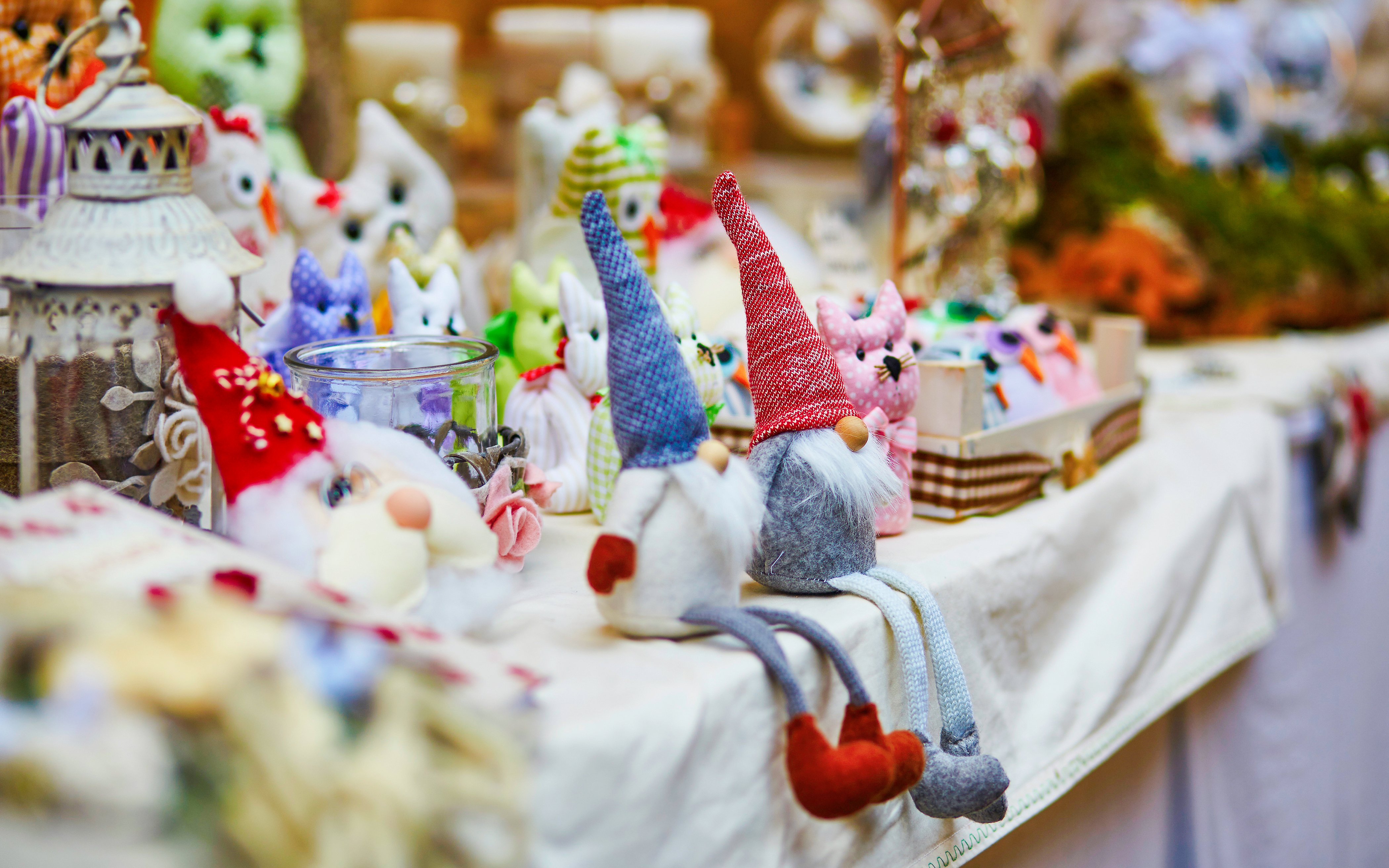 Handcrafted gnome dolls displayed at a market stall in San Diego's Little Italy.