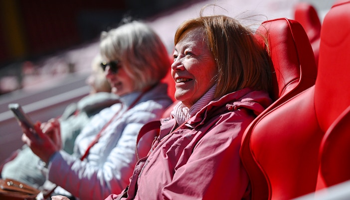 Guests enjoying seats at Anfield Stadium, Liverpool.