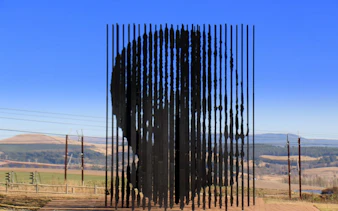 Mandela Capture Site sculpture with scenic landscape in South Africa.