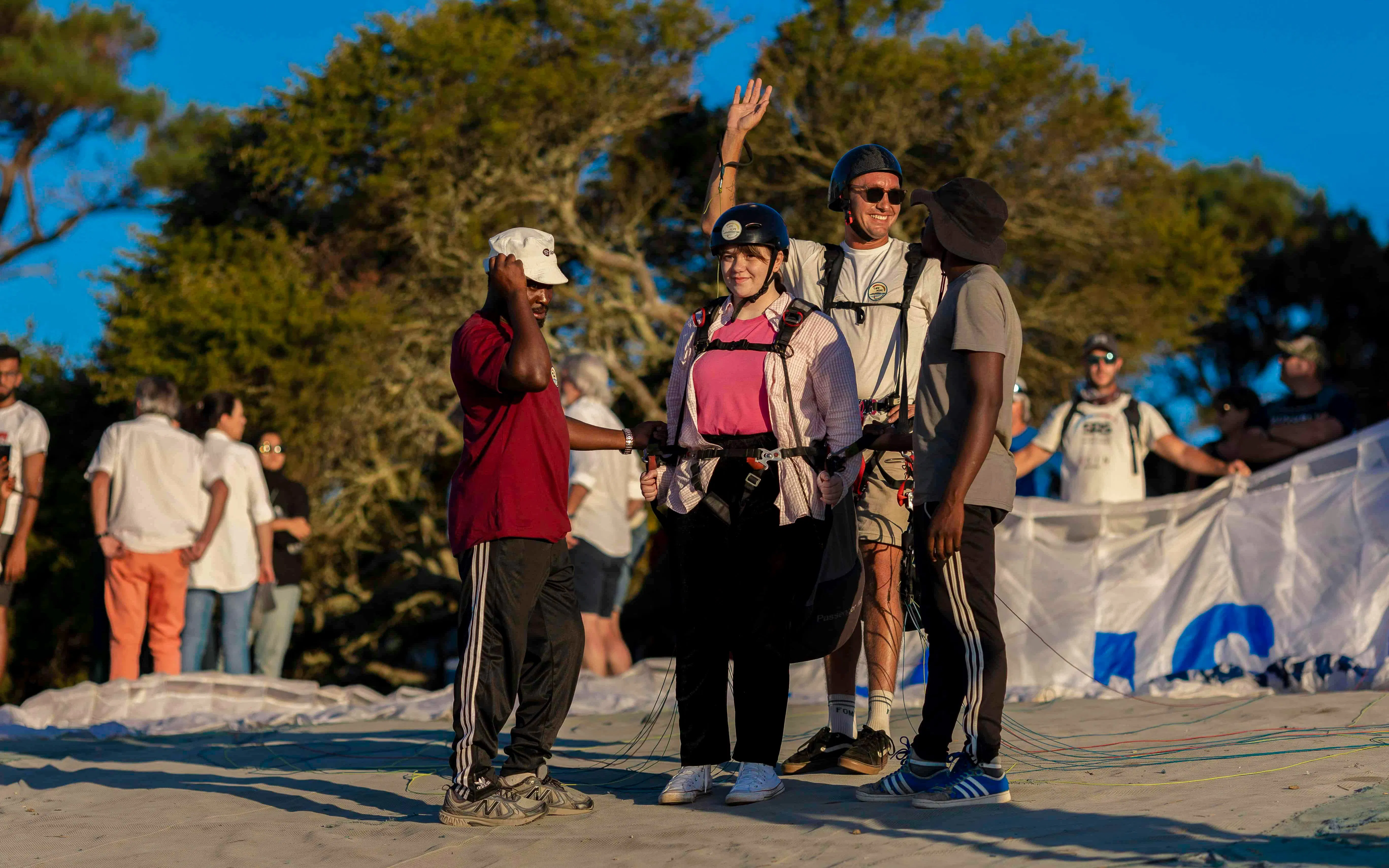 Guests preparing for tandem paragliding in Cape Town with instructors.