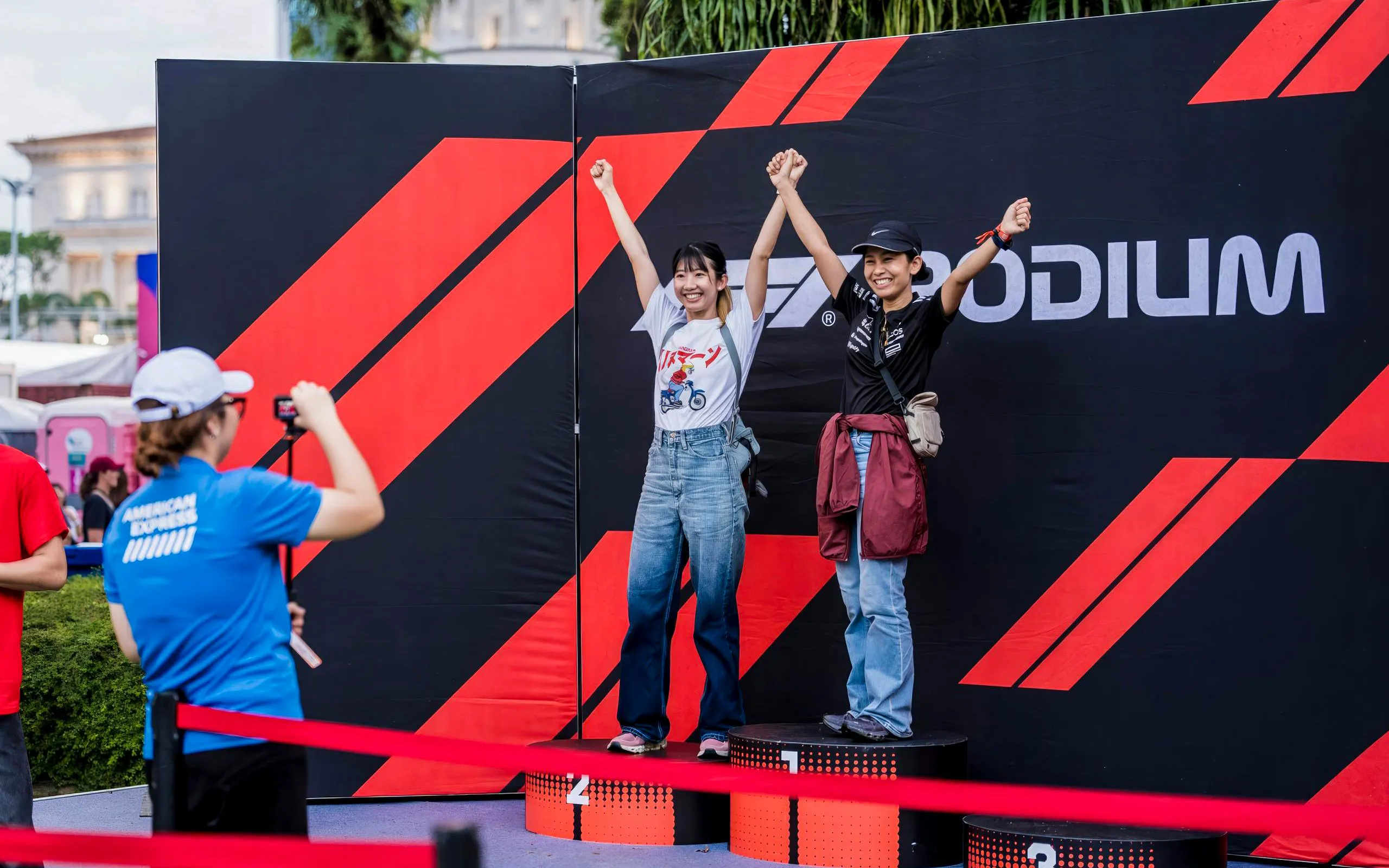 Guests celebrating on podium at Formula 1 Singapore Grand Prix.