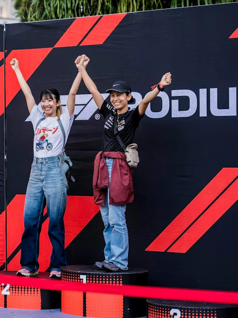 Guests celebrating on podium at Formula 1 Singapore Grand Prix.