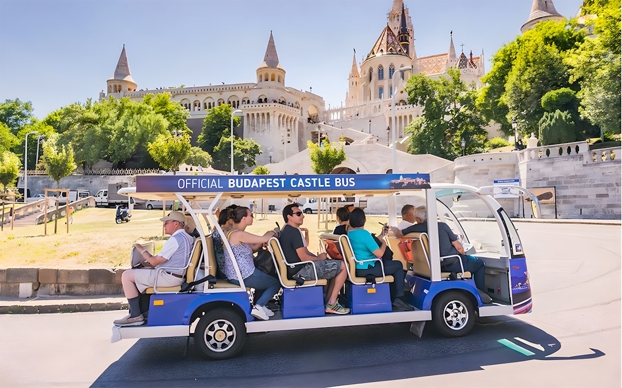 Budapest Castle Bus near Fisherman's Bastion with tourists in Budapest.