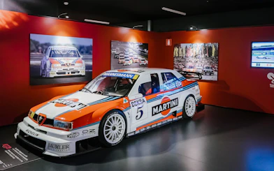 Alfa Romeo 155 race car on display at Museo Nazionale dell'Automobile, Turin.