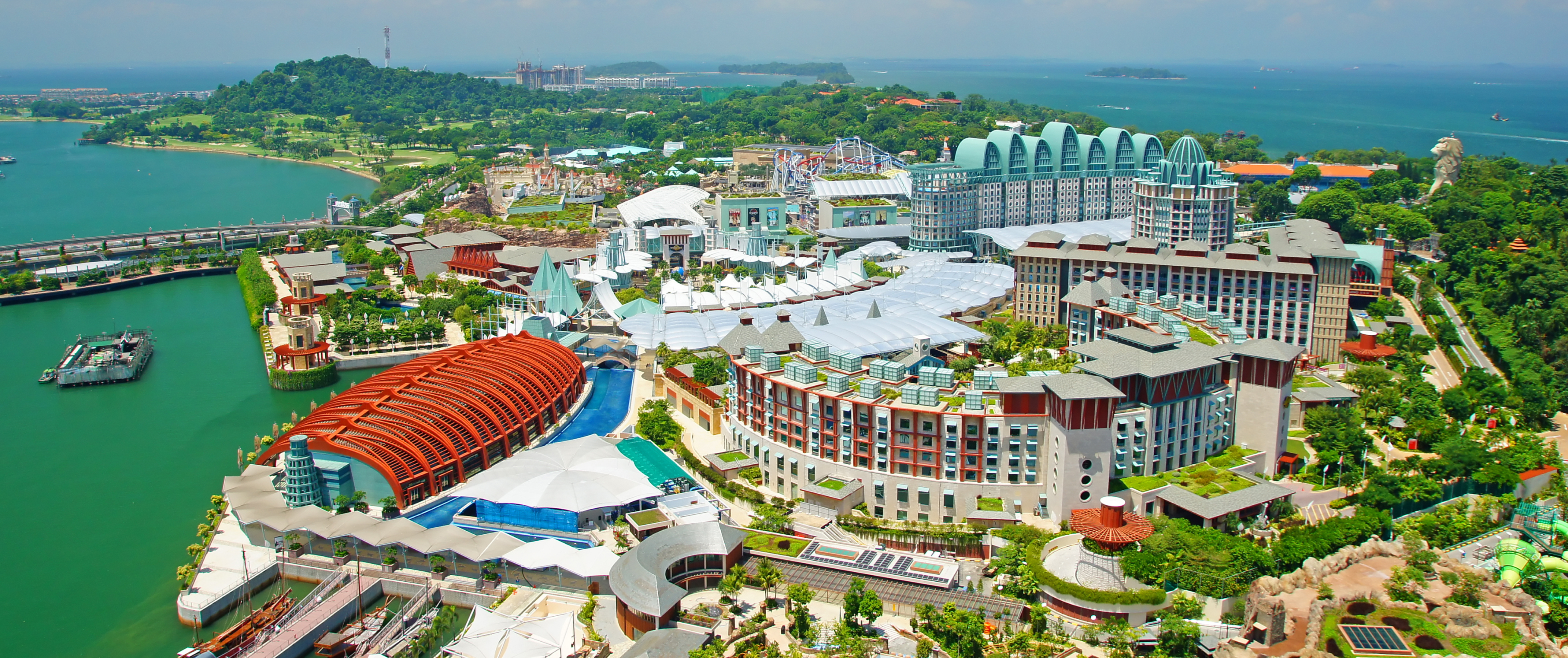 Aerial view of Sentosa Island's resort area with lush greenery and waterfront.