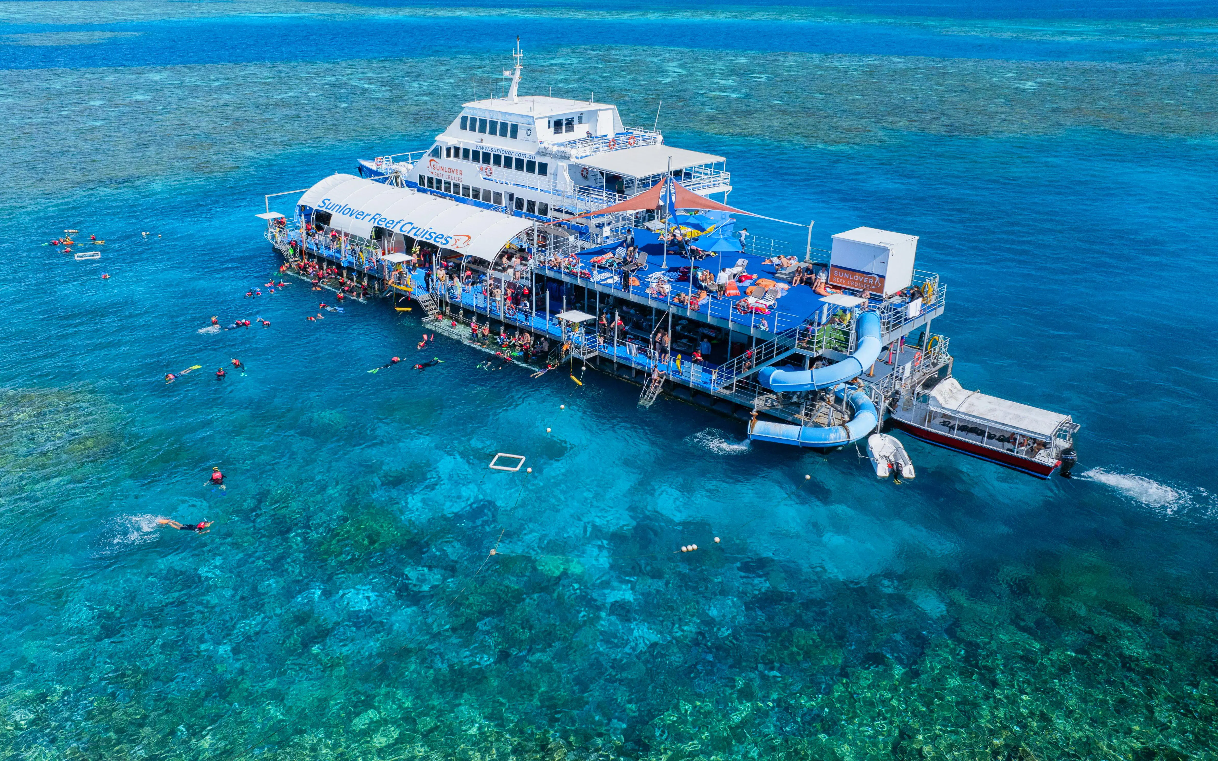 Sunlover Reef Cruises pontoon with snorkelers at Great Barrier Reef.