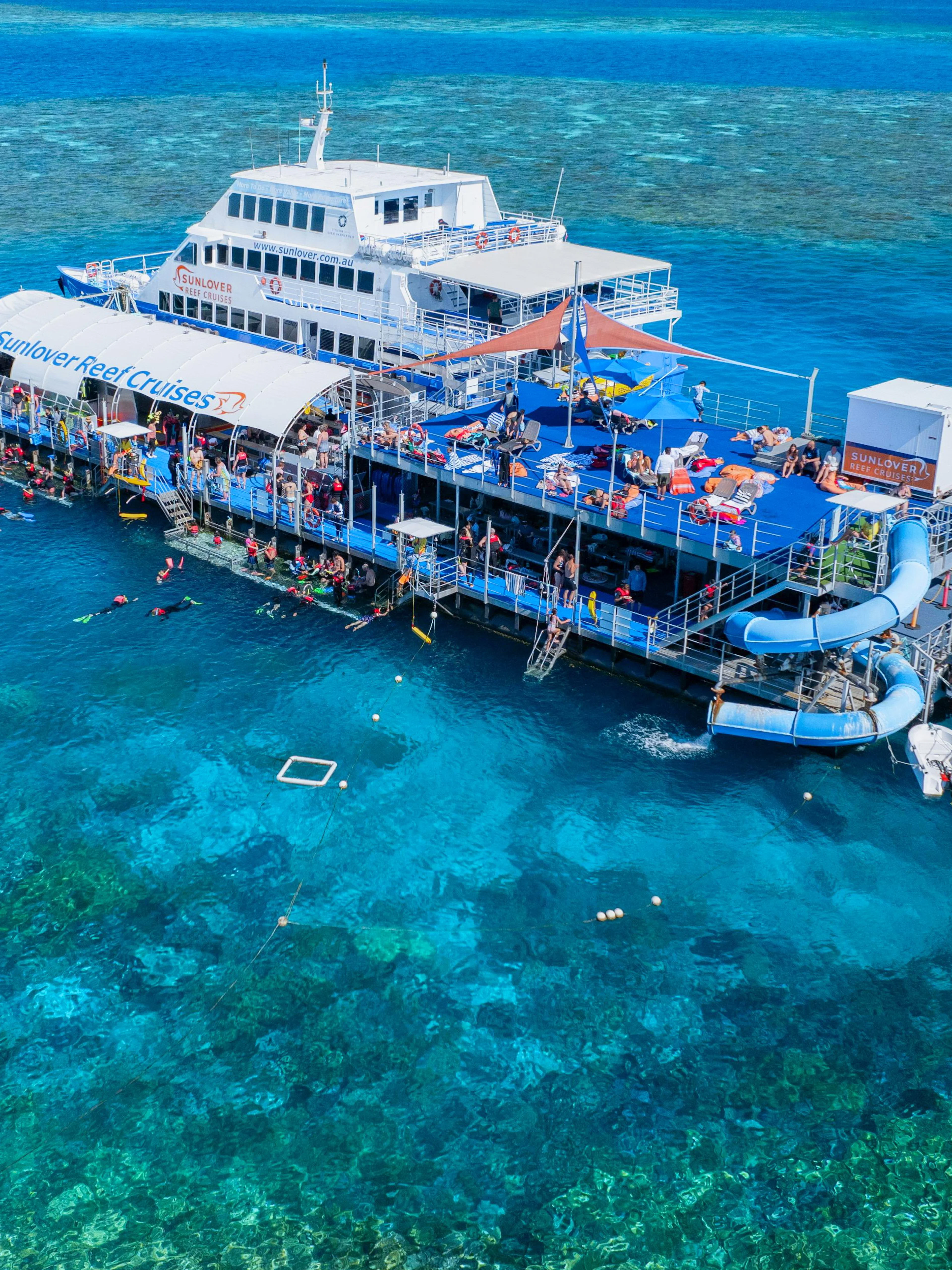 Sunlover Reef Cruises pontoon with snorkelers at Great Barrier Reef.