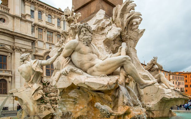 Fiumi Fountain statues in Piazza Navona, Rome, depicting river gods.