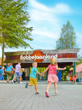 Children running towards Bobbejaanland entrance in Belgium.