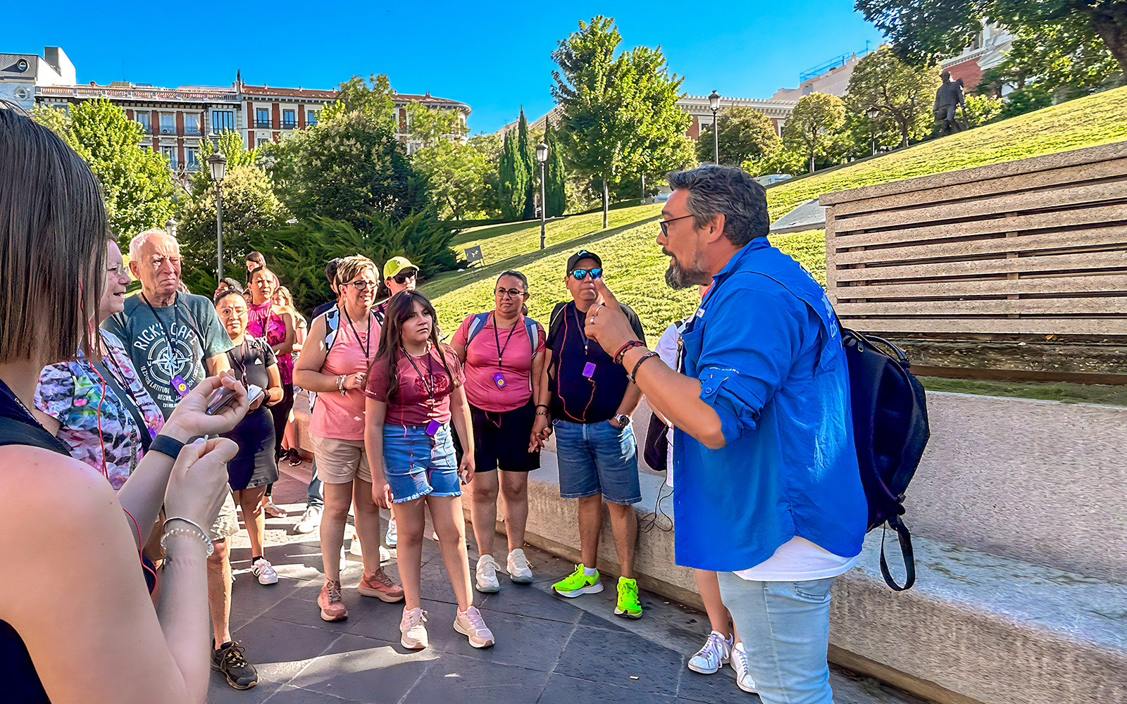 Tour guide speaking to a group outside the Prado Museum in Madrid.