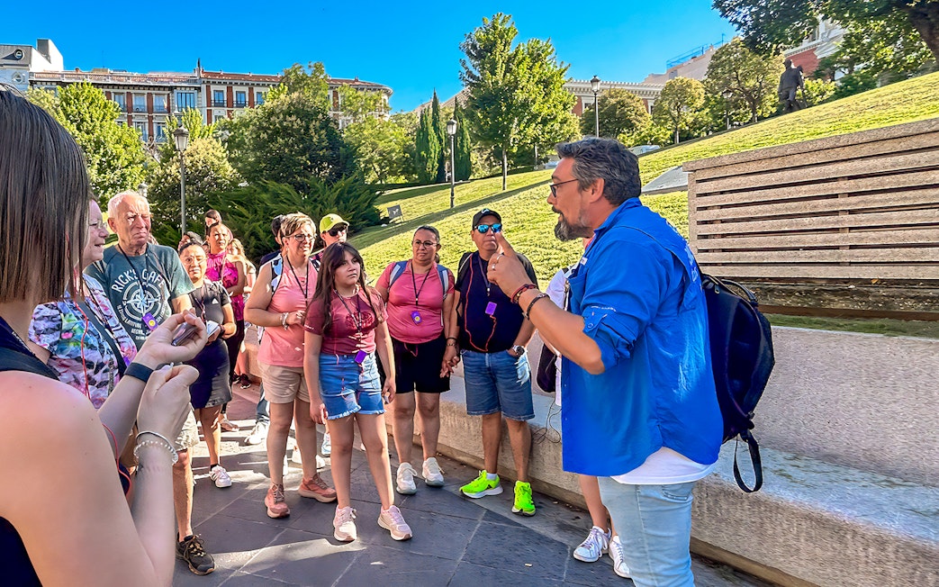 Tour guide speaking to a group outside the Prado Museum in Madrid.