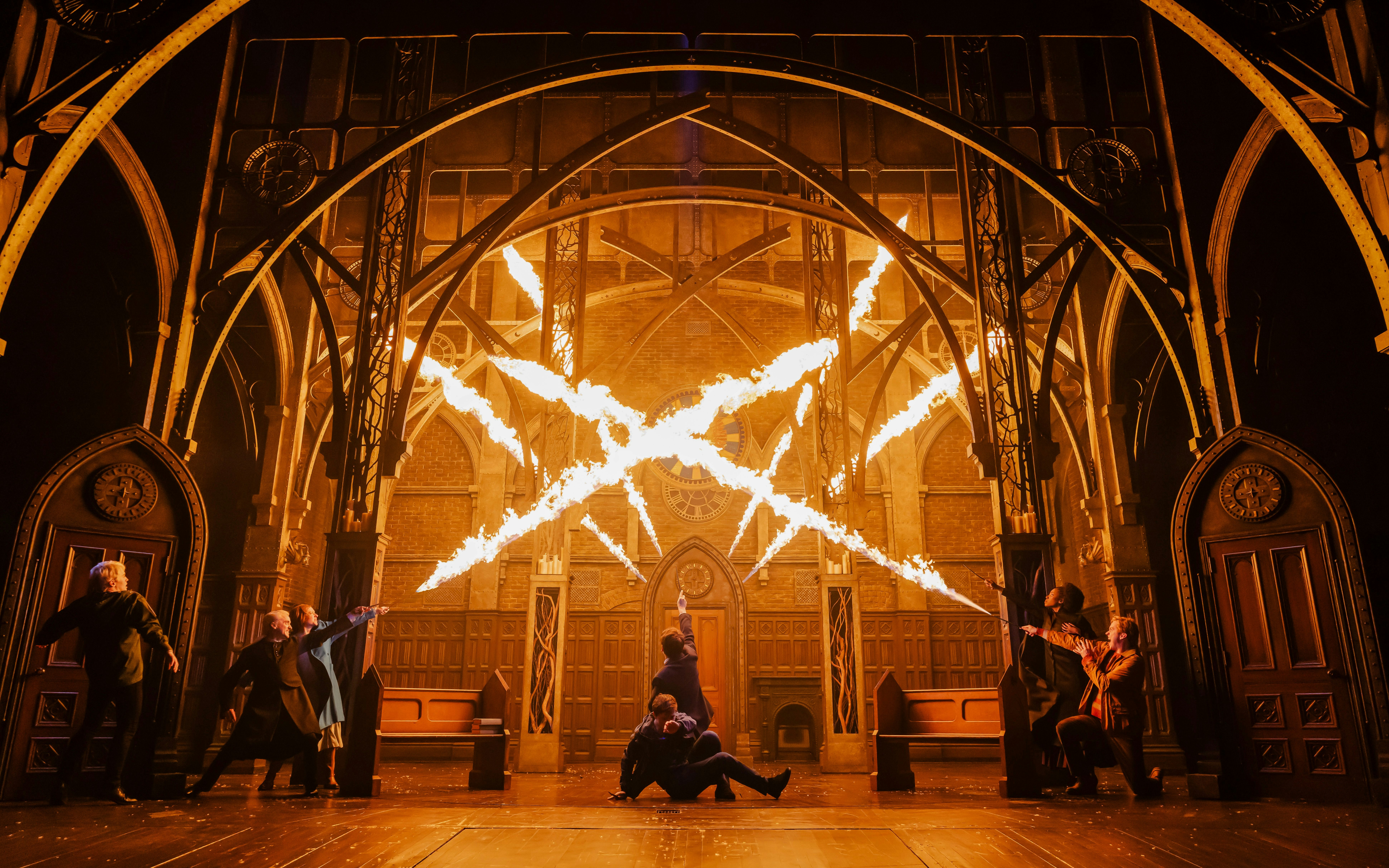 Stage scene from Harry Potter and the Cursed Child on Broadway with actors casting spells.