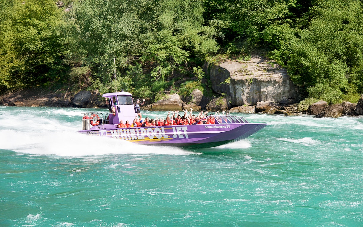 Guests enjoying Whirlpool Jet Boat Tour in Niagara Gorge, Canada.