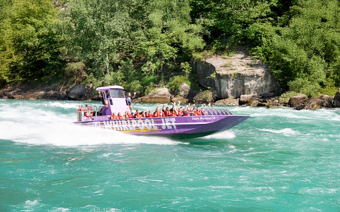 Guests enjoying Whirlpool Jet Boat Tour in Niagara Gorge, Canada.