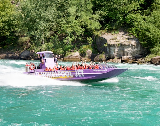 Guests enjoying Whirlpool Jet Boat Tour in Niagara Gorge, Canada.