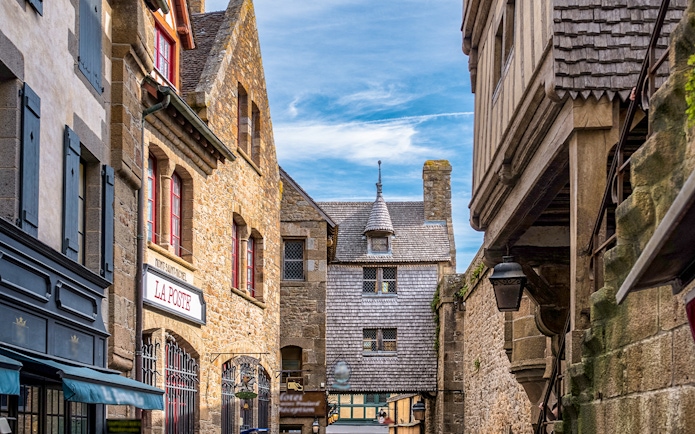 Stone buildings and shops on Mont Saint Michel walking tour.