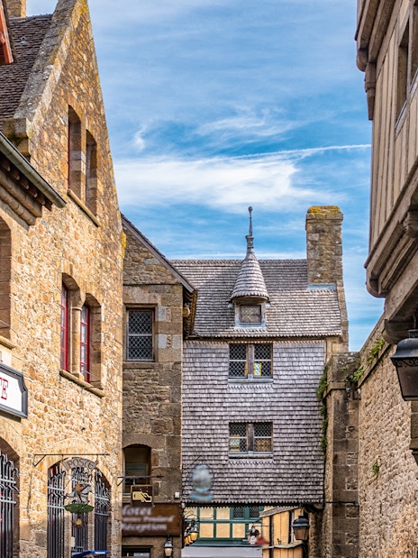 Stone buildings and shops on Mont Saint Michel walking tour.