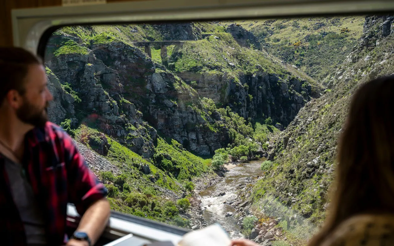 View of Deep Stream Bridge from Taieri Gorge train window, New Zealand.