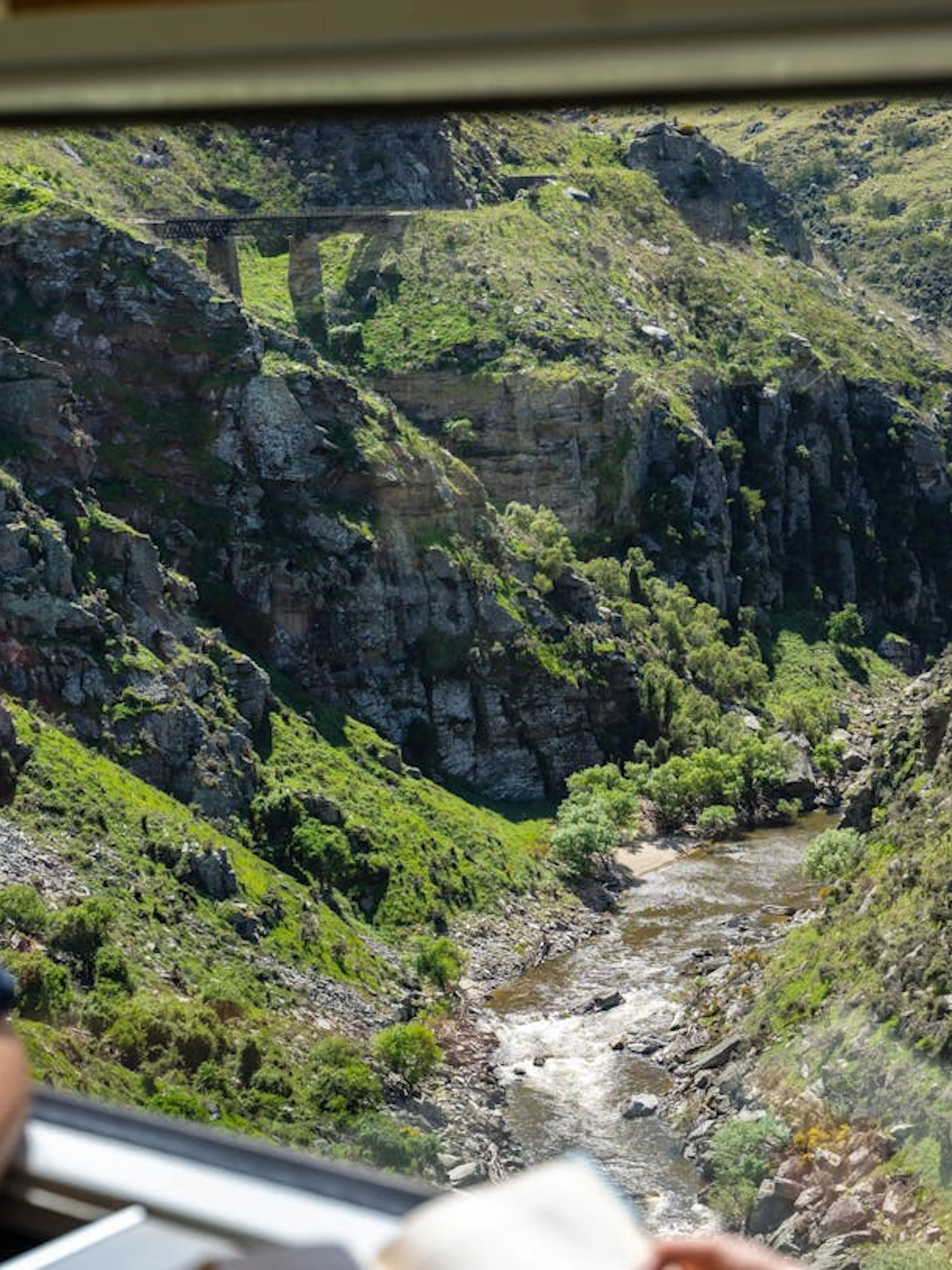 View of Deep Stream Bridge from Taieri Gorge train window, New Zealand.