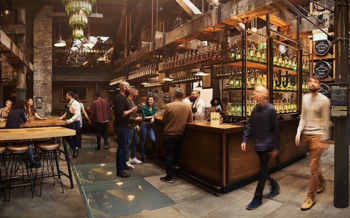 Visitors enjoying tastings at Jameson Whiskey Distillery bar in Dublin.