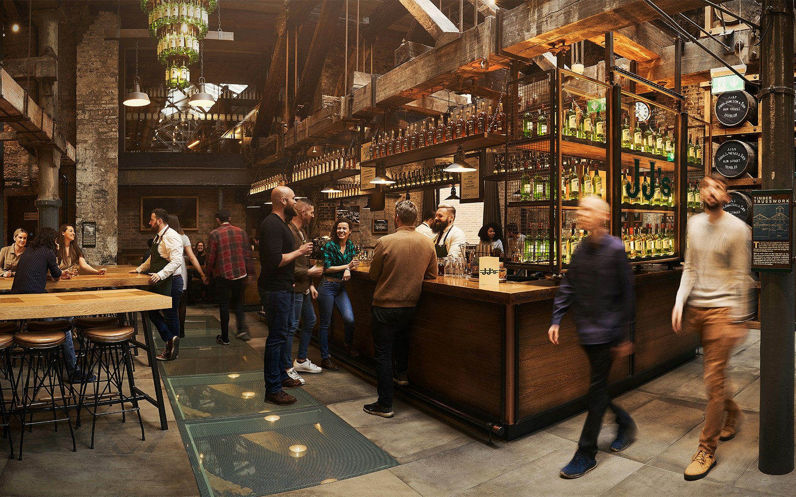 Visitors enjoying tastings at Jameson Whiskey Distillery bar in Dublin.
