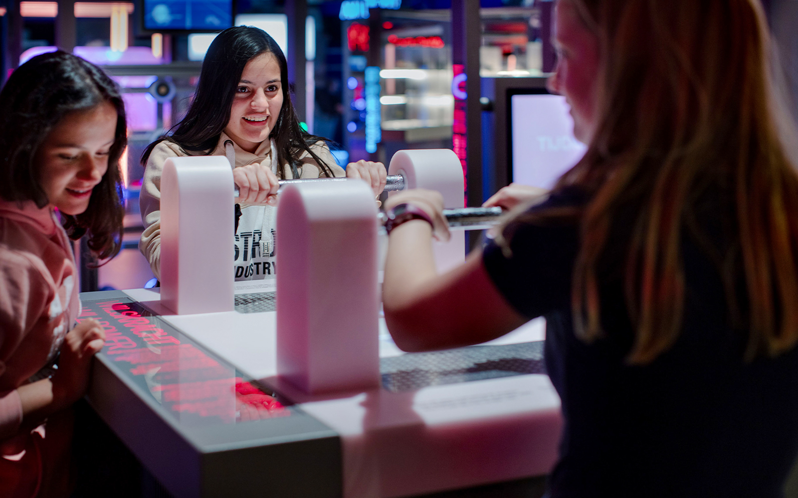 Visitors engaging with interactive exhibit at NEMO Science Museum, Amsterdam.