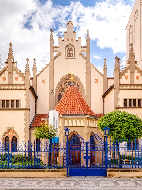 Maisel Synagogue in Prague with Gothic architecture and blue fence.