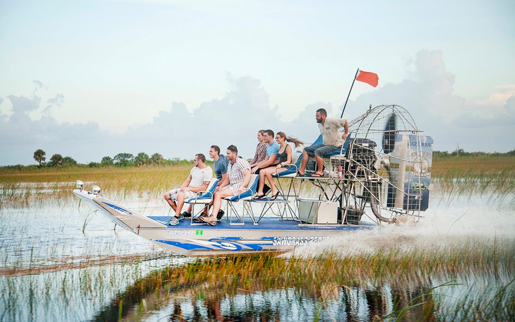 Group enjoying an airboat tour in the Everglades, Florida.