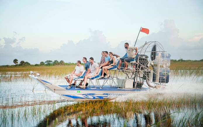 Group enjoying an airboat tour in the Everglades, Florida.