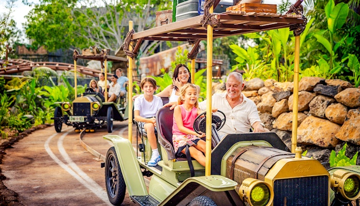 Dreamworld's Rivertown, Gold Coast, featuring a scenic car ride through lush landscapes.