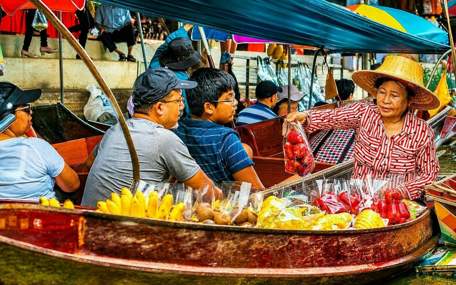 Vendors selling fruits from boats at a bustling floating market.