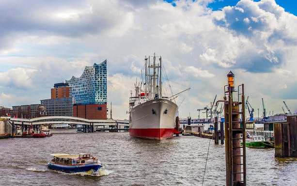 Harbor boat tour passing Elbphilharmonie in Hamburg with live commentary.