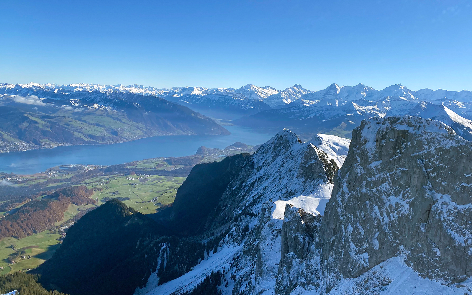 Aerial view of Stockhorn Mountain with Lake Thun in the background during a helicopter tour from Bern-Belp Airport.