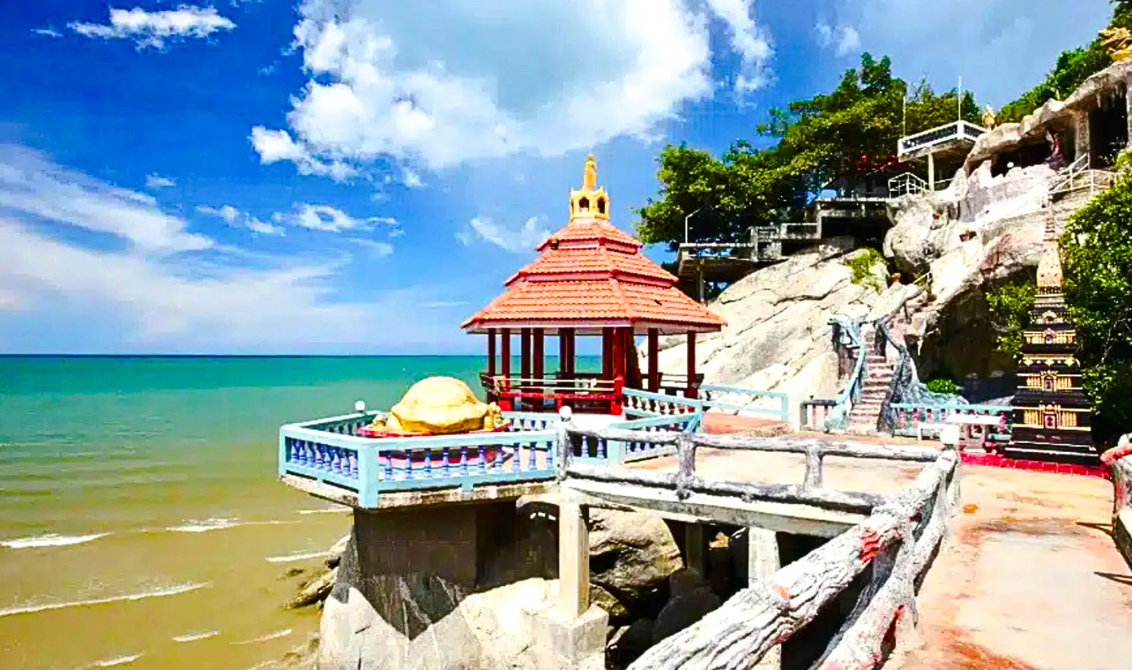 Seaside pavilion at Khao Takiab Temple, Hua Hin, on a sunny day during a Bangkok to Hua Hin tour.