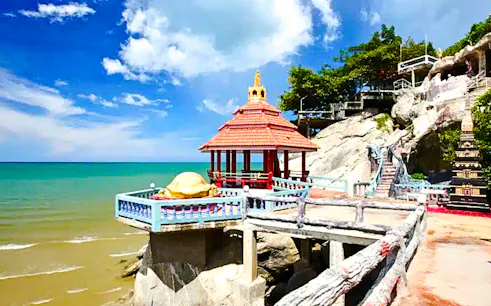 Seaside pavilion at Khao Takiab Temple, Hua Hin, on a sunny day during a Bangkok to Hua Hin tour.