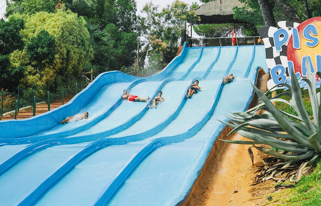 Visitors enjoying water slides at Aqualandia Benidorm.