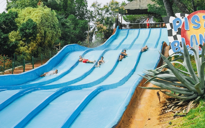 Visitors enjoying water slides at Aqualandia Benidorm.