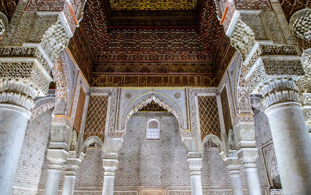 Saadian Tombs mausoleum interior with ornate arches and columns in Marrakech, Morocco.