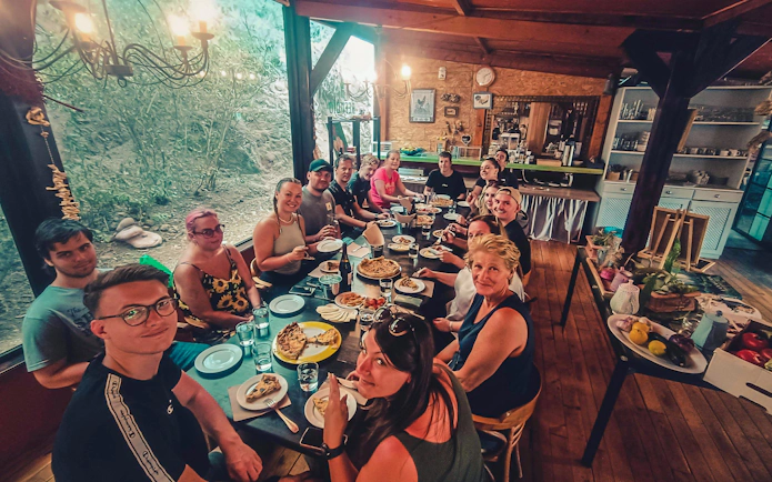 Group enjoying local food tasting on Gran Canaria volcano sunset tour.