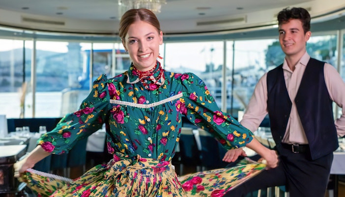 woman performing during folklore show on budapest dinner cruise