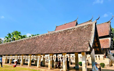 Wat Phan Tao temple with traditional lanterns and visitors in Chiang Mai.