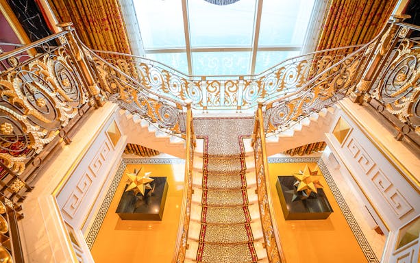 Elegant staircase inside Burj Al Arab during guided tour with afternoon tea.