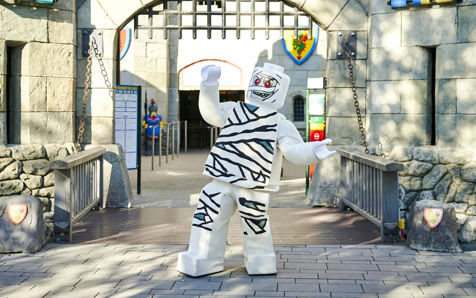 Mummy-themed Lego character at Legoland Billund entrance during Halloween event.
