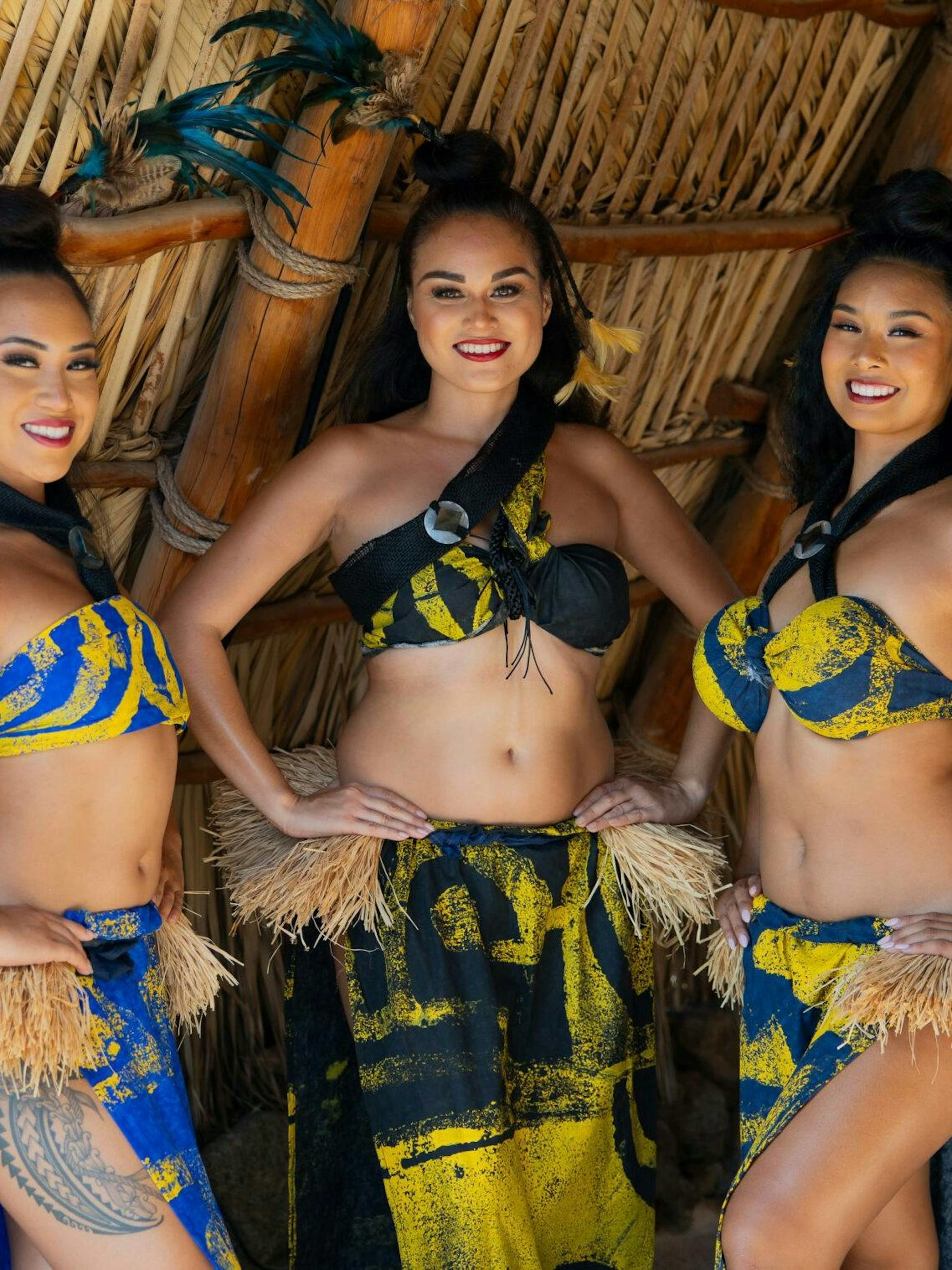 Traditional Hawaiian dancers in colorful attire at a Kaula-Luau event.