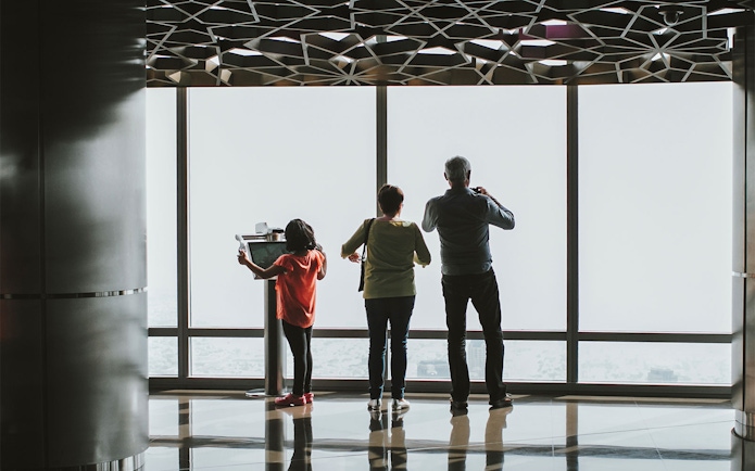 Visitors enjoying the view from Burj Khalifa's observation deck, Dubai.