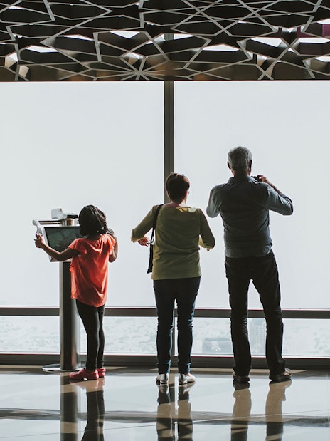 Visitors enjoying the view from Burj Khalifa's observation deck, Dubai.