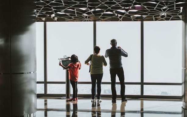 Visitors enjoying the view from Burj Khalifa's observation deck, Dubai.