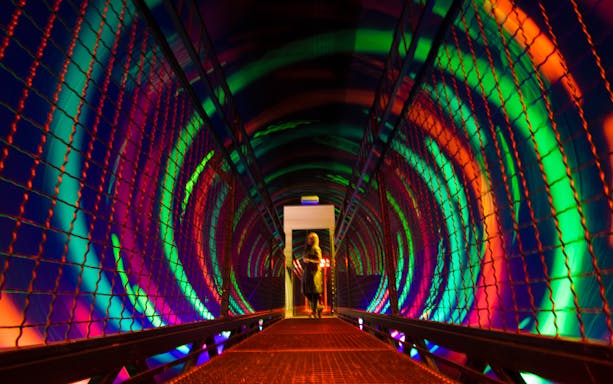 Vortex tunnel with colorful lights at Museum of Senses.