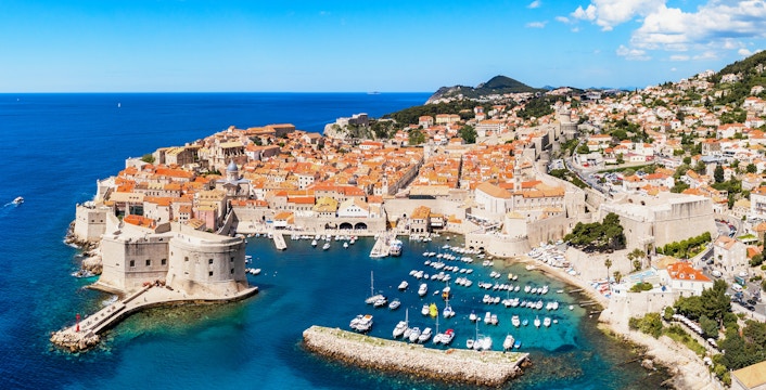 Aerial view of Dubrovnik's old city center with historic walls and Adriatic Sea, Croatia.